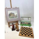 A Chinese wooden chess set and folding board, with 3 carved wooden figurines and a silk painting