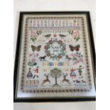 A 1990 sampler, good quality with intricate detail. In black and gilt frame. W:55cm x H:64cm