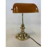 A Modern library style lamp with amber coloured shade. H:37cm