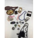 A quantity of costume jewellery including a silver brooch, vintage brooches, fresh water pearls, a