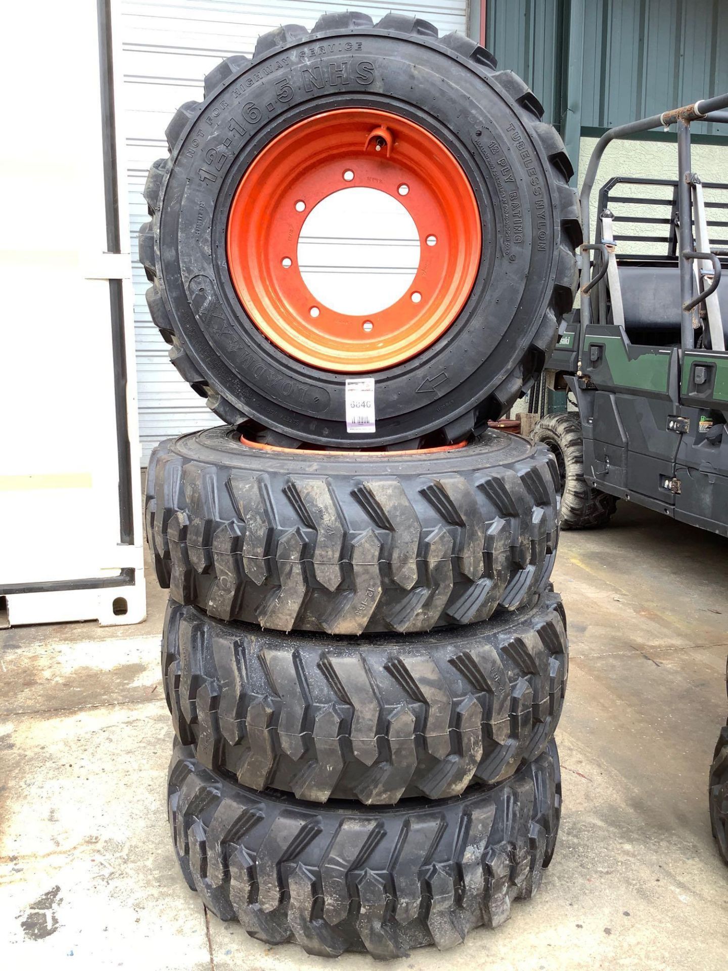( 4 ) LOADMAXX 12-16.5 N.H.S TIRES FOR SKID STEER, 8 LUG HOLES , 12 PLY RATING