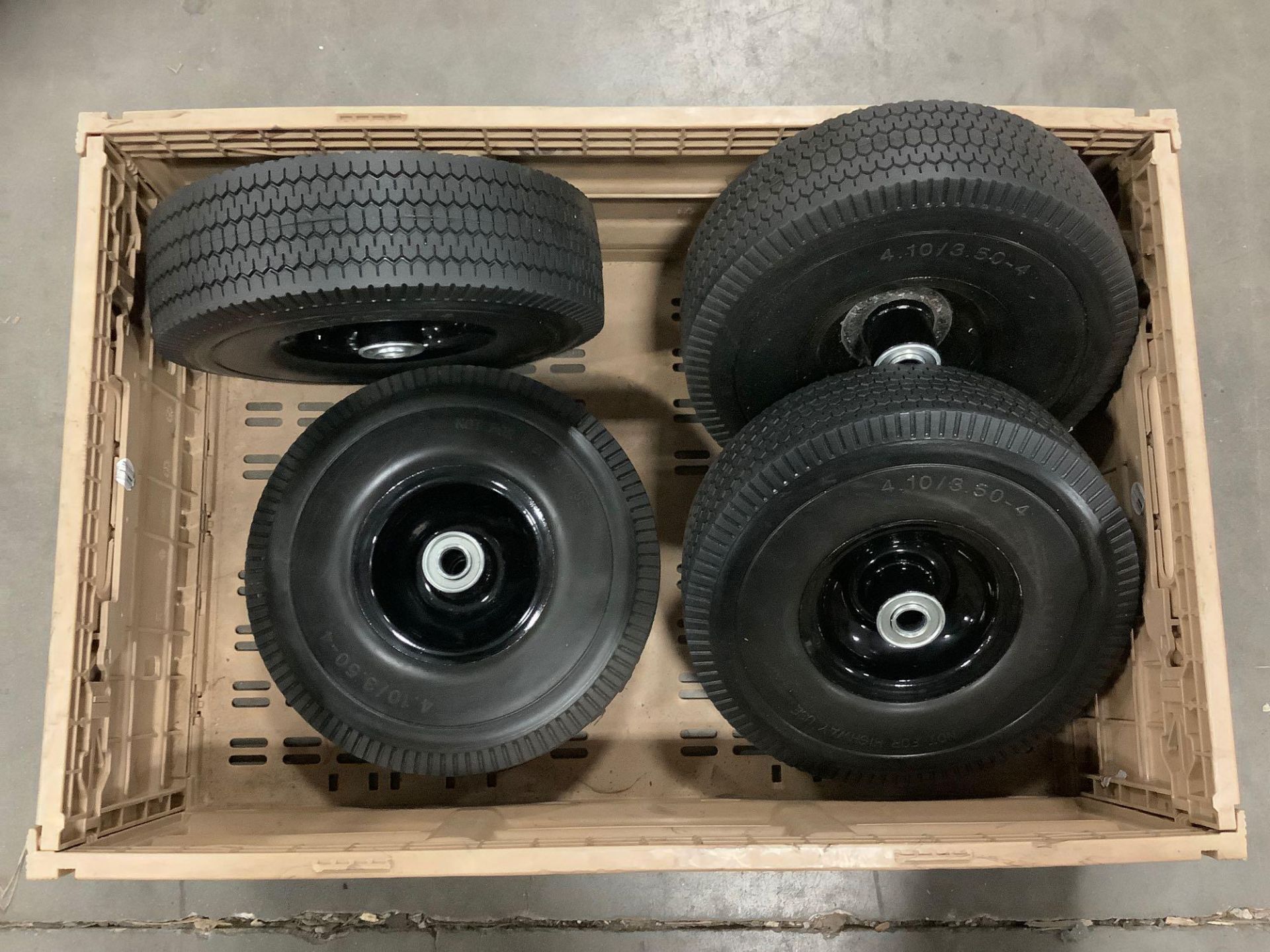 ( 4 ) UNUSED 10” SOLID TIRES 4.10/3.50-4 WITH CARRYING CRATE - Image 2 of 3