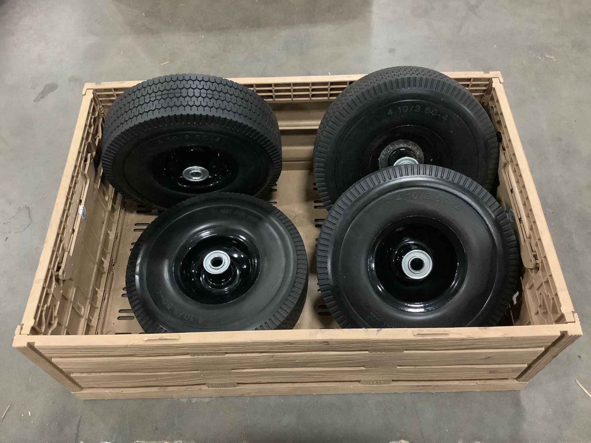 ( 4 ) UNUSED 10” SOLID TIRES 4.10/3.50-4 WITH CARRYING CRATE
