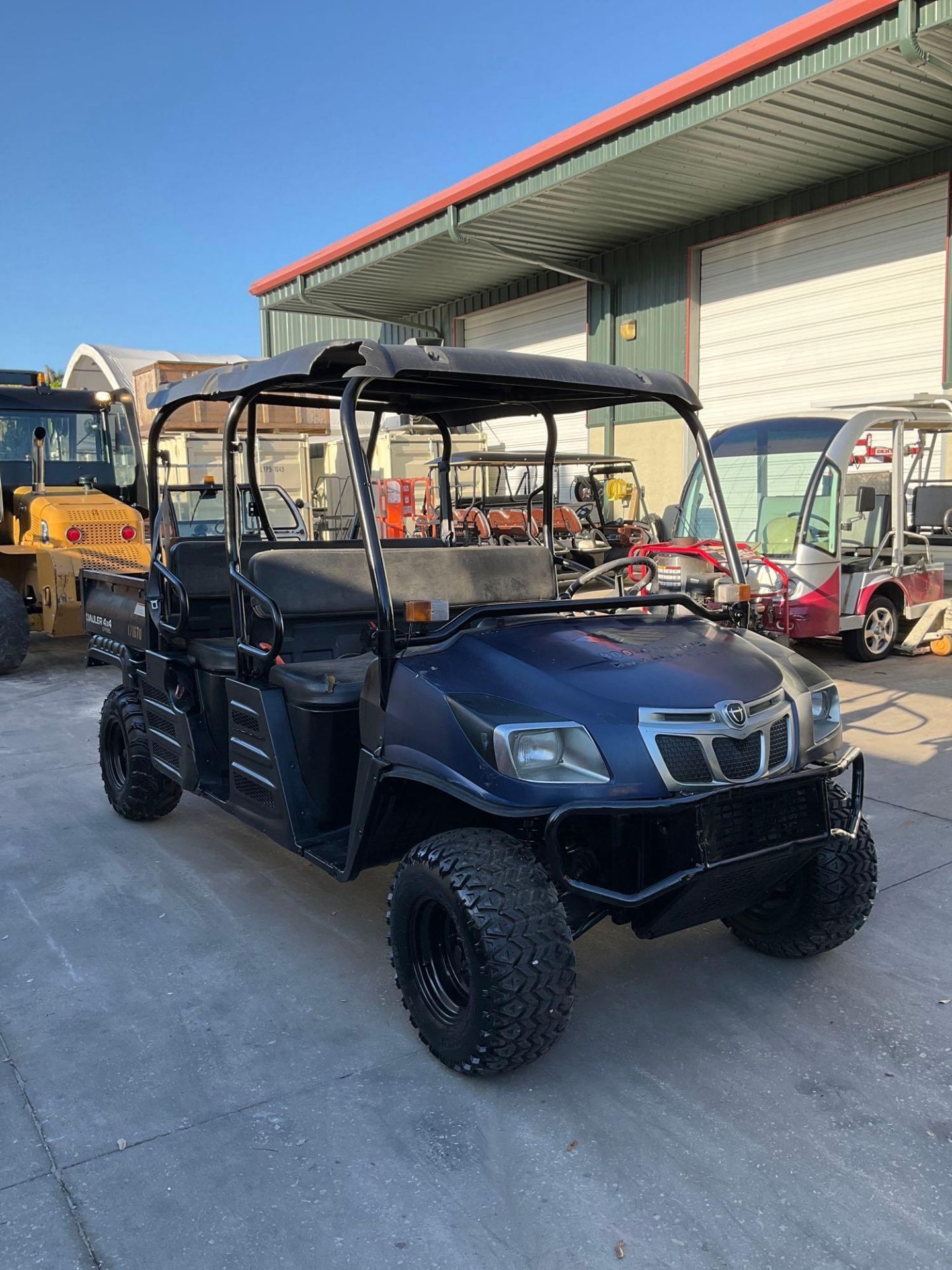 CUSHMAN HAULER 4x4 UTV, DIESEL, CREW CAB, MANUAL DUMP BED, NEW BATTERY, RUNS AND OPERATES - Image 7 of 11