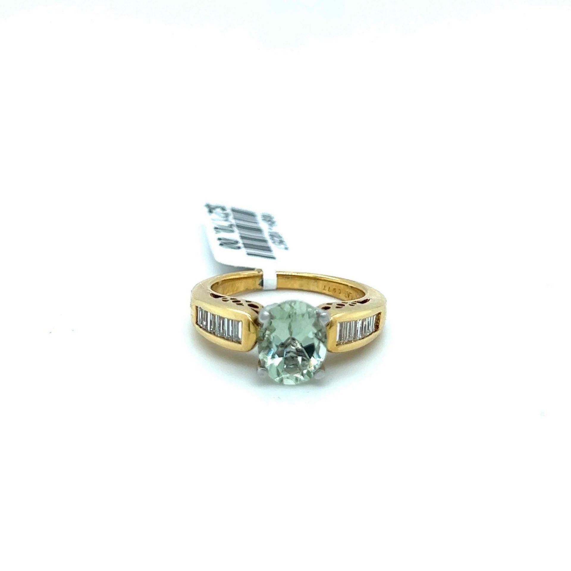 1.63CT GREEN QUARTZ AND .39CT BAGUETTE DIAMOND RING 14K GOLD