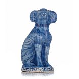 A Dutch Delft blue and white figure of a seated dog, 18thC, H 16,5 cm