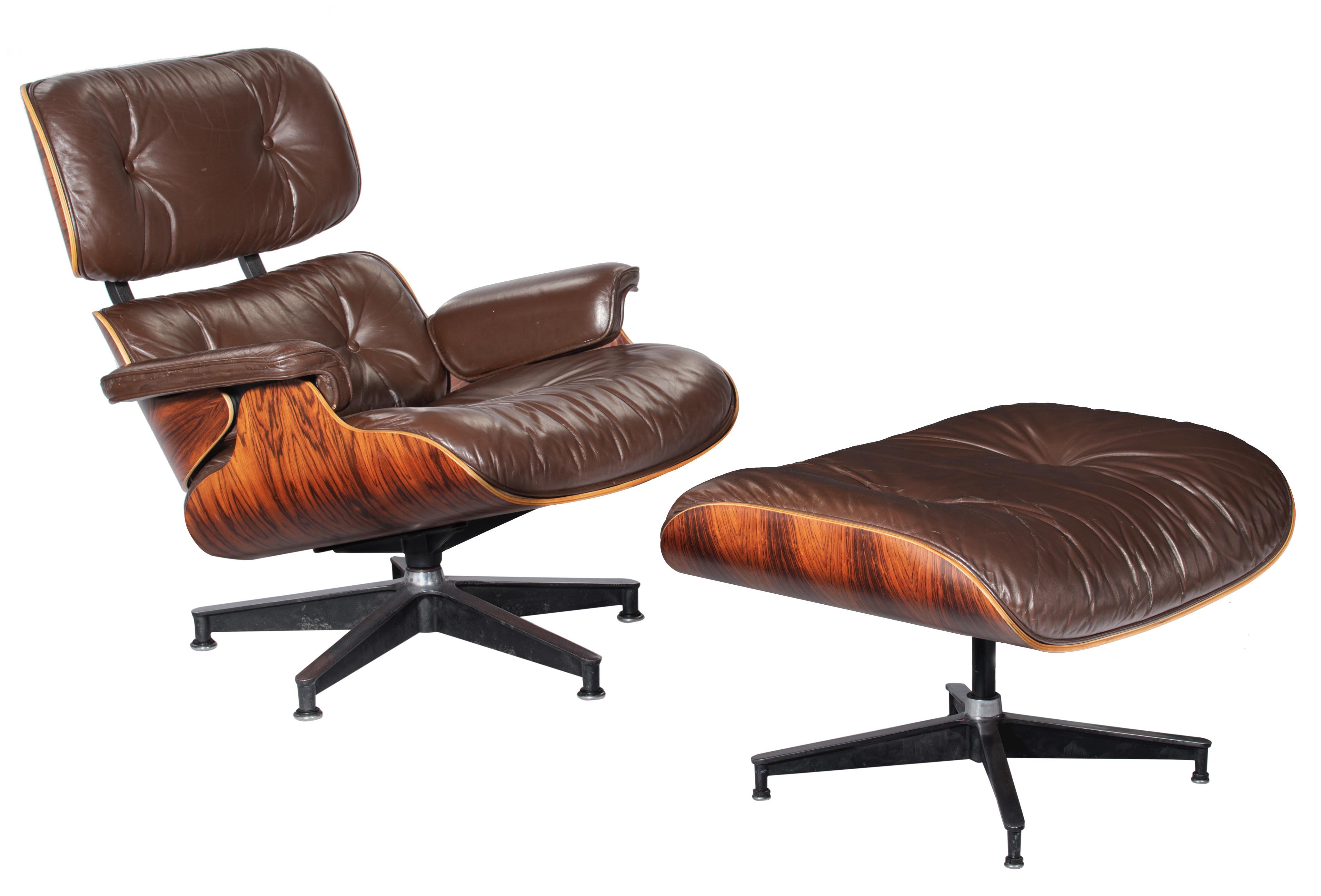 An Eames lounge chair with a matching ottoman, late 70s edition, marked Herman Miller, H 42,5 - 80 -