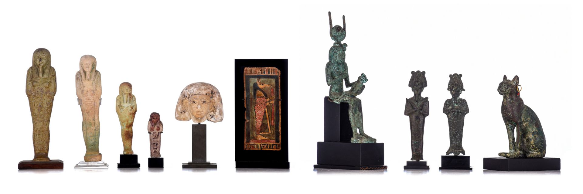 A collection of 10 Egyptian works of art in various materials, 7,6 - 23,5 cm (+)