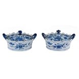 A pair of Dutch Delft blue and white butter tubs, floral decorated, 19thC, H 7,5 - W 14 cm