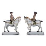 A pair of Dutch Delft cold-painted models of prancing Lipizzaner horses with gallant horsemen, 18thC