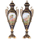 An imposing pair of Sèvres type vases and covers, decorated with gallant scenes, signed 'B. Charlott