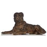 An Austrian cold painted terracotta lying pug dog, H 30,5 - 32,5 cm, H 32,5 - W 77 cm