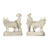 A pair of Delft white-glazed models of cows and cowherds, 18thC, H 14 - W 14,5 cm