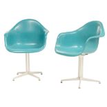 A pair of blue Eames 'DAL' (dining armchair Lafonda base) chairs, H 83 W 64,5 cm