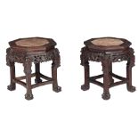Two Chinese octagonal hardwood bases with a marble plaque, H 47,5 cm