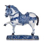 A large Delft blue and white figure of a circus horse, marked Jacob van der Kool, early 18thC, H 23