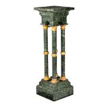 (T) A Neoclassical vert de mer marble four-column pedestal, H 114 cm