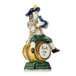 A fine Delft polychrome figure of a wine-drinking man, 19thC, H 14 cm