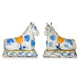 A pair of Delft polychrome figures of recumbent horses, H 13,5 cm