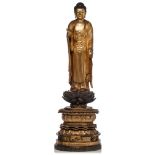 A Japanese gilt-wood standing figure of Amitabha Buddha, on a finely carved lotus base, Edo period,