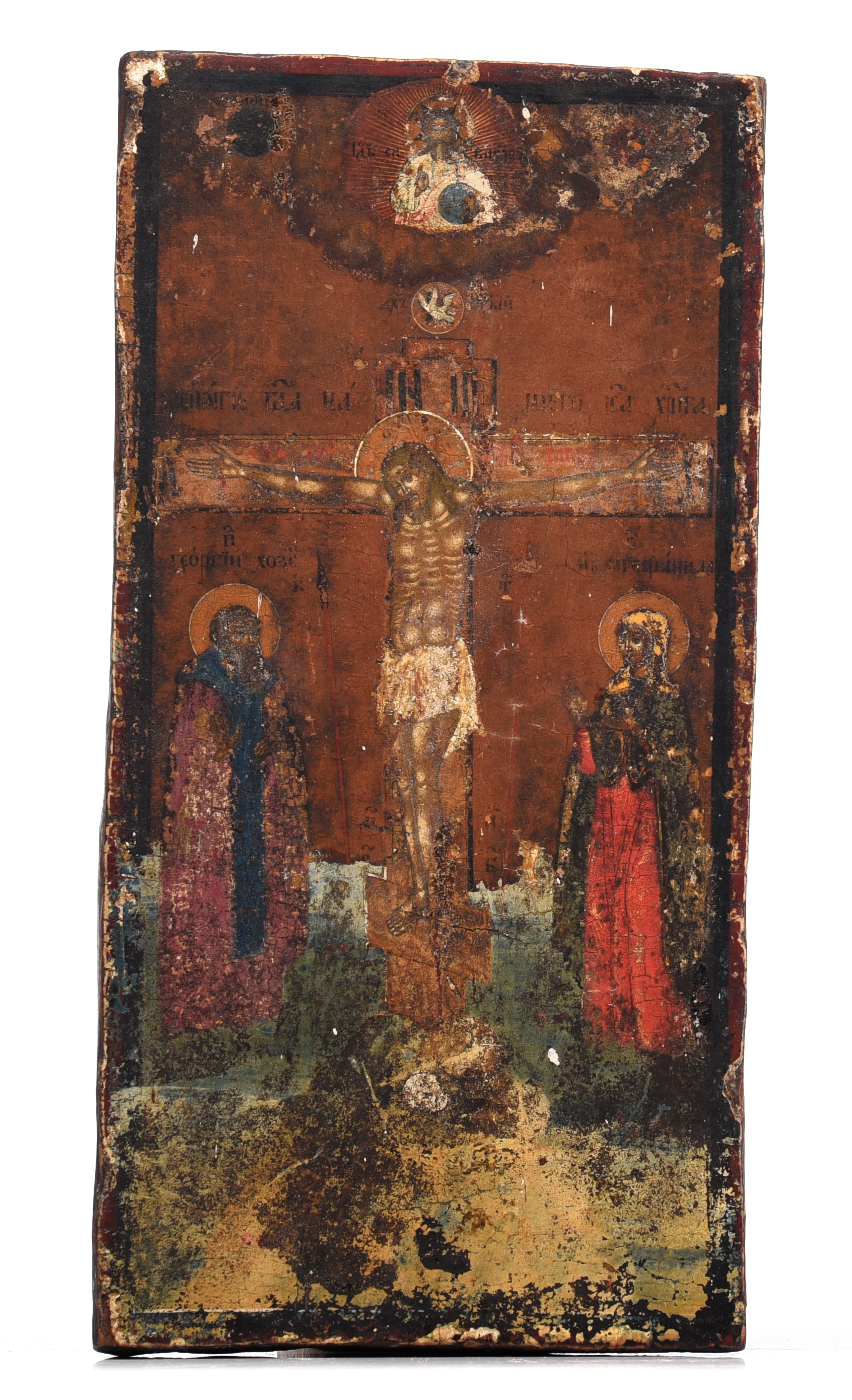 (T) An Eastern European icon, crucifixion scene with two saints, 17thC, 16 x 31 cm