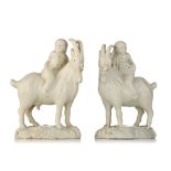 A pair of Dutch Delft white-glazed models of boys riding goats, 18thC, H 13 cm