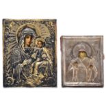 (T) Two small Eastern European silverplated icons, 19thC