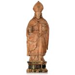 A limewood sculpture of a bishop, with a reliquary to the bottom, 17thC, H 52 cm