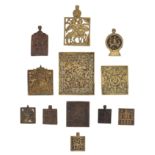(T) A collection of 12 smaller brass icons, some decorated with enamel, 17th - 18thC