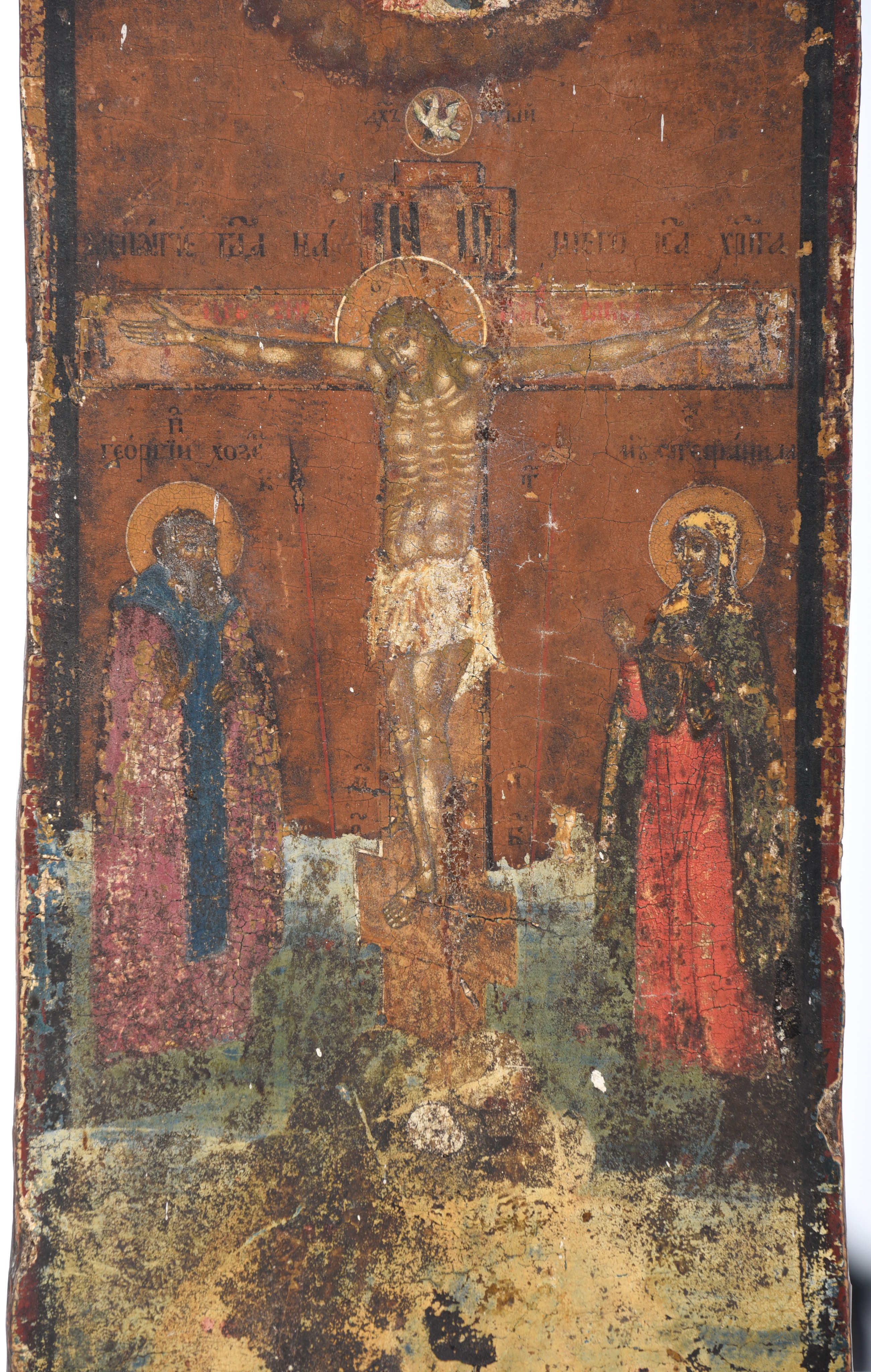 (T) An Eastern European icon, crucifixion scene with two saints, 17thC, 16 x 31 cm - Image 4 of 5