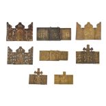 (T) A collection of 8 smaller brass icon triptychs, some decorated with enamel, 18th - 19thC