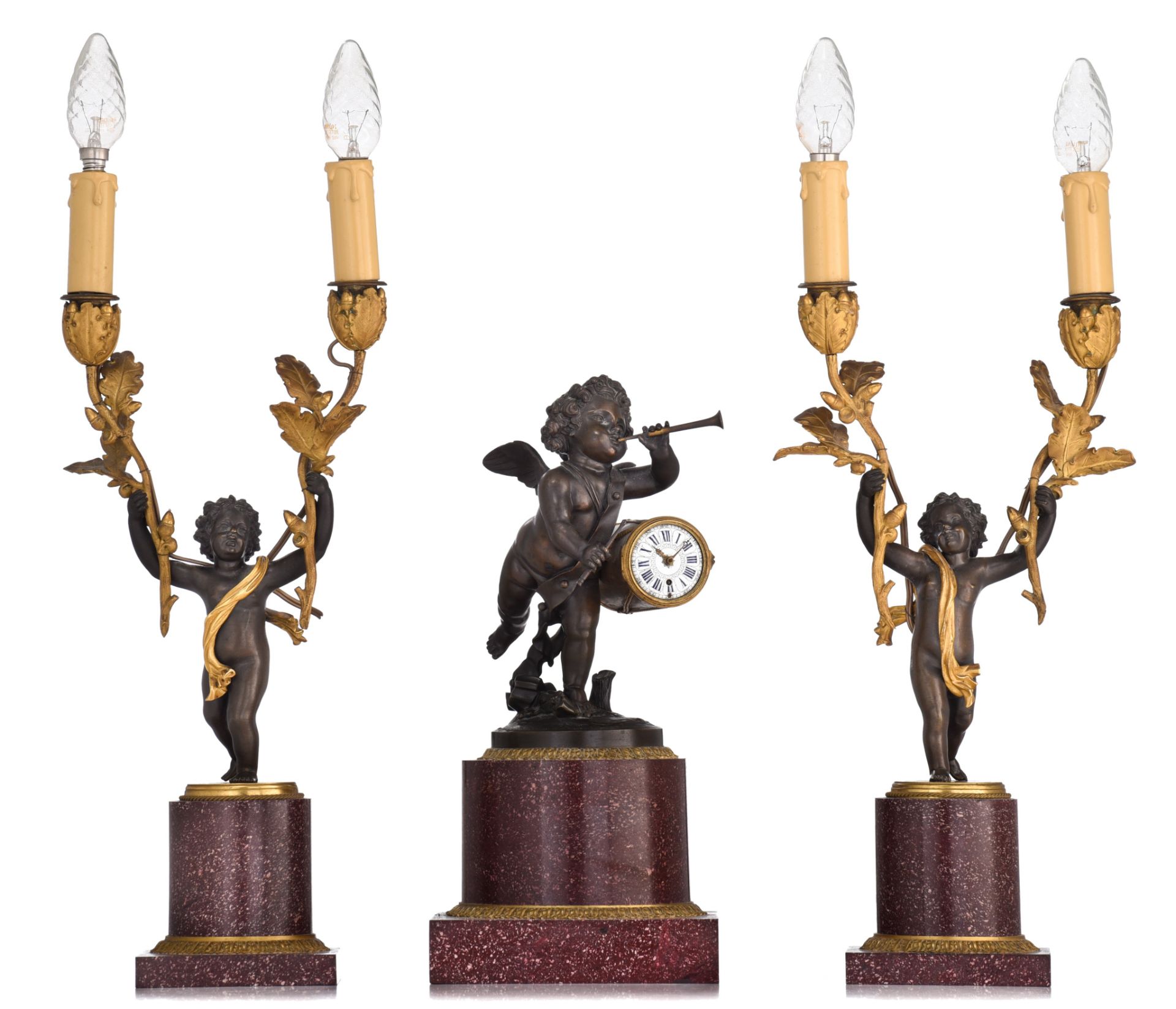 A fine Empire three-piece clock garniture, patinated and gilt bronze on rouge Napoleon marble, signe