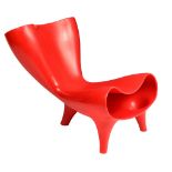 A red plastic 'Orgone' chair, designed by Mark Newson in 1993, H 83 - W 78 cm