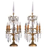 A pair of Neoclassical gilt brass and cut glass girandoles, H 71 cm
