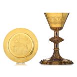 A richly decorated silver, and gilt silver chalice with a matching paten made by Bourdon - Gand, H 2