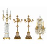 A collection of various candelabras and a girandole, H 61,5 - 65 cm