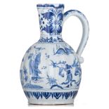 A very fine Dutch Delft blue and white chinoiserie pitcher, marked, 18thC, H 20,5 cm