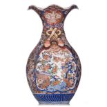 A Japanese Imari vase, on a matching wooden base, 19thC, H 60,5 cm