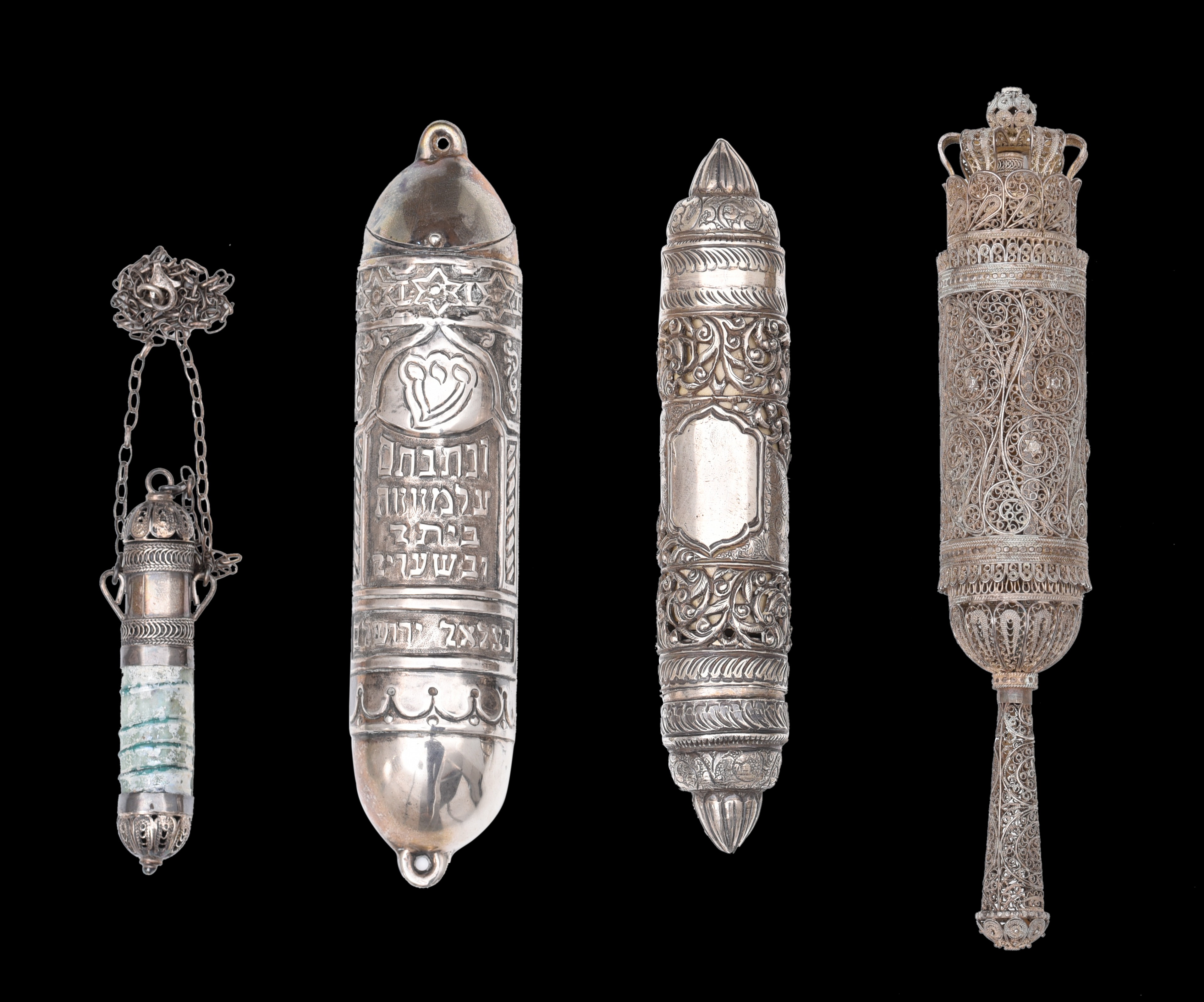 (BIDDING ONLY ON CARLOBONTE.BE) A collection of three silver Judaica Esther scroll cases and a match