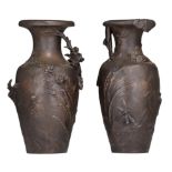 (BIDDING ONLY ON CARLOBONTE.BE) A pair of patinated spelter vases with flower relief decoration, sig