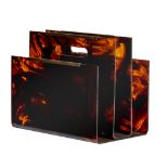 (BIDDING ONLY ON CARLOBONTE.BE) A tortoiseshell imitation lucite magazine rack holder, in the manner