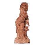 A terracotta figure of a putto warming himself, representing 'Winter', 18thC, H 58 cm