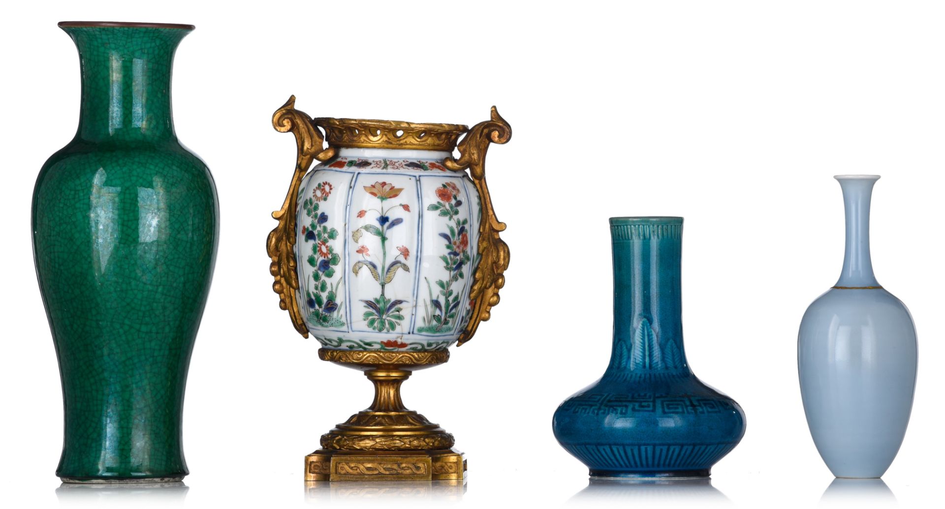 Three Chinese monochrome glazed vases and a famille verte jarlet, one with a Kangxi mark, tallest H