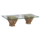 A coffee table formed by two Romanesque capitals, glass top, H 36 - W 149,5 - D 59,5 cm