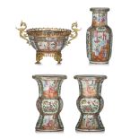 A collection of Chinese Canton famille rose vases and a metal mounted punch bowl, 19thC, tallest H 3