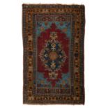 (BIDDING ONLY ON CARLOBONTE.BE) An oriental woollen carpet, decorated with geometric motifs and butt