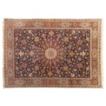 An Oriental woollen rug with a central medaillon, floral decorated, 297 x 394 cm