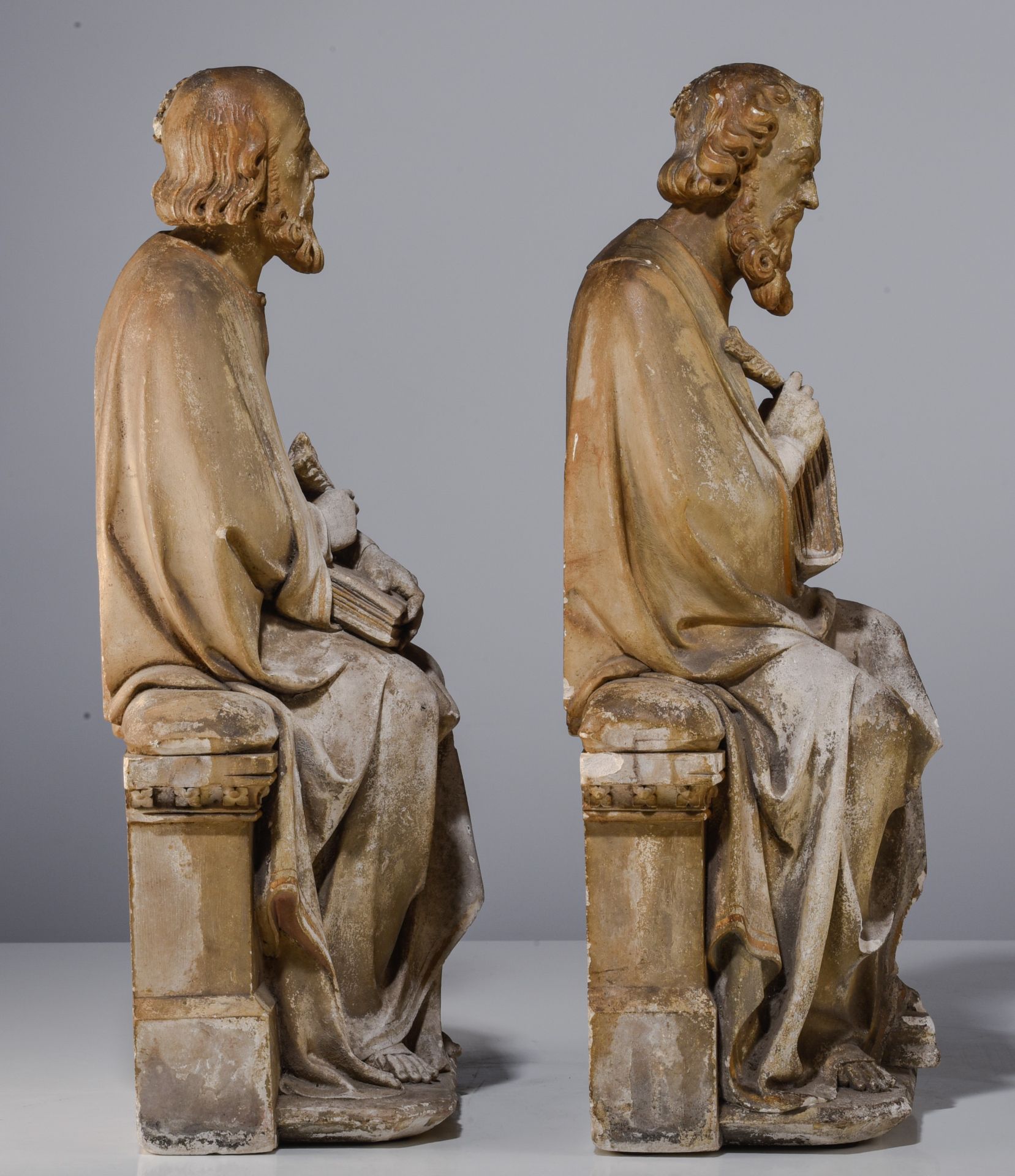 A pair of patinated reconstituted stone sculptures of seated Evangelist, in the style of the 15thC, - Image 5 of 12