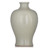 A Chinese carved celadon-glazed vase, late 19thC/20thC, H 31 cm