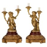 (BIDDING ONLY ON CARLOBONTE.BE) A fine pair of gilt bronze candelabra lights, with young Satyrs hold